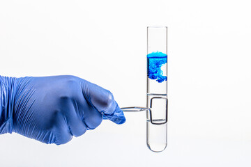 Researchers scientist working analysis with blue liquid test tube in the laboratory, chemistry science or medical biology experiment technology, pharmacy development solution.