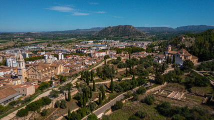 Fototapeta na wymiar Jativa ,Valencia, Spain, Europe. Aerial photo from drone to Spanish town of Xativa on background of Roman Catholic Basilica. (Series)