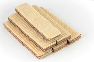 Wafers with chocolate on a white backgrounds. Neapolitan wafers.