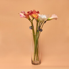 Decorative ceramic vase. Beautiful floral arrangement of af artificial plant in flower pot. Stylish Interior composition in home design