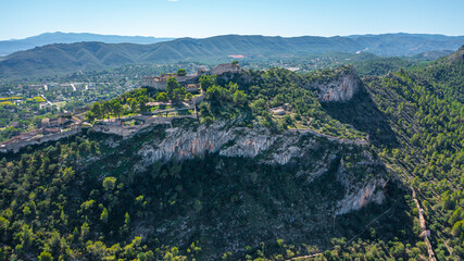 Aerial photo from drone to ancient famous castle of Xativa against the backdrop of mountain valleys  a sunny summer day. Xativa,Valencia, Spain,Europe (Series)