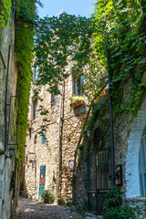 Ancient streets to houses in Bussana Vecchia damaged and earthquake with plants and flowers