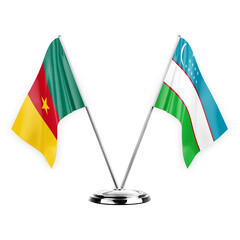 Two table flags isolated on white background 3d illustration, cameroon and uzbekistan