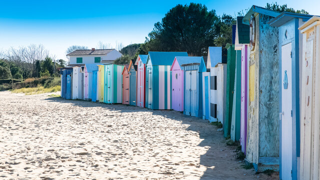 Wooden beach cabins on the Oleron island in France, colorful huts
