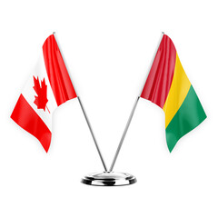 Two table flags isolated on white background 3d illustration, canada and guinea