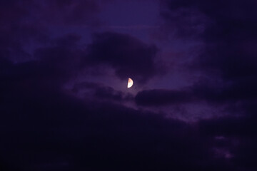 Obraz na płótnie Canvas moon in the dark cloudy night sky
