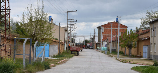 Fototapeta na wymiar Village street with houses