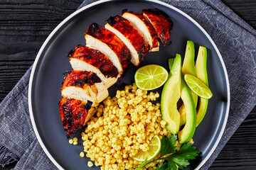 grilled chicken breast with ptitim, avocado, lime