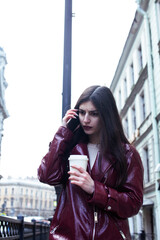 Fototapeta premium young pretty girl outside in city street with coffee happy smiling, lifestyle fashion peopple concept