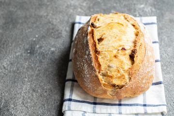 Freshly baked sourdough bread with dried tomatoes.