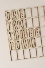 numbers one to four inside a wooden grid