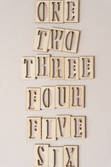 the numbers one to six spelled out in stencil font on paper