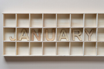 background with the month of january in a shallow box