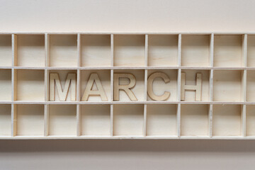 background with the month of march in a shallow box