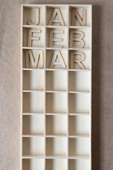 abbreviation of month (jan to mar) in a shallow wooden box