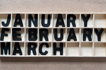 the months of january, february, march arranged in a shallow box