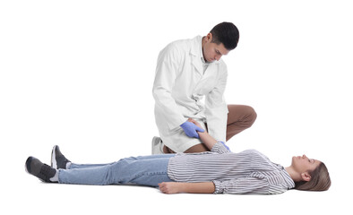 Doctor in uniform practicing first aid on woman against white background