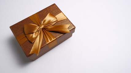 Gift box with a ribbon on a white background. Valentine concept, New year Concept, Christmas Concept. Top view, Anniversary Concept. High angle view, Flat Lay.