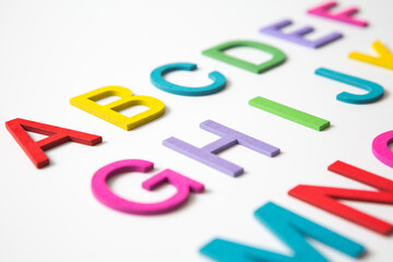 Colorful wooden english letters A-Z on white background