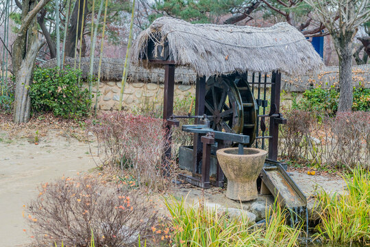 Old fashioned waterwheel mill at Gwanghallu Pavilion park in South Korea.