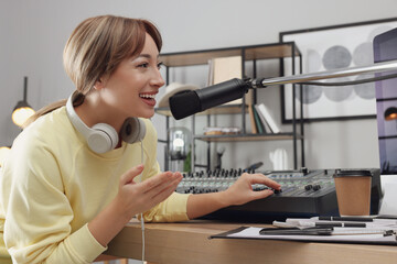 Woman working as radio host in modern studio