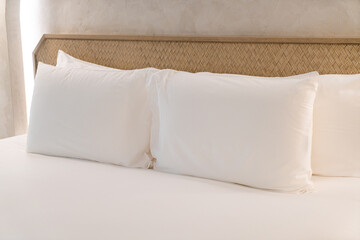 comfortable white pillows on bed