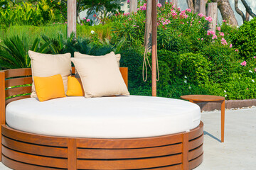 pillows on outdoor patio chair with umbrella