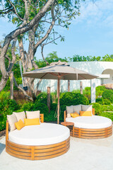 pillows on outdoor patio chair with umbrella