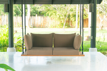 empty sofa swing in garden