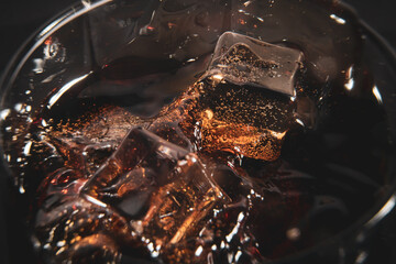 Ice cubs in a glass of soda
