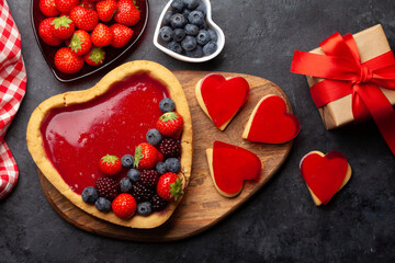 Heart shaped sweet cake with berries