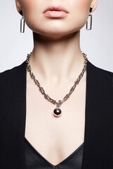 stylish jewelry on girl in leather dress