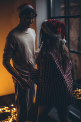 Naklejka premium Boyfriend and girlfriend at Christmas. High quality photo