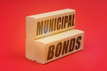On a red background, wooden blocks with the inscription - MUNICIPAL BONDS