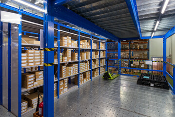 Interior of logistics warehouse with racks and shelves