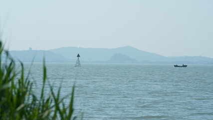 The beautiful lake landscapes with the traditional Chinese architecture along the shore