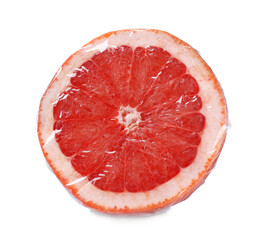 Half of fresh grapefruit wrapped with transparent plastic stretch film isolated on white