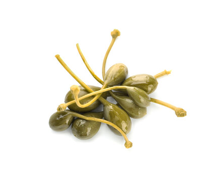 Pile of delicious pickled capers on white background, top view