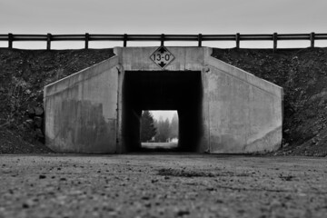 narrow tunnel under highway