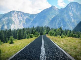 Naklejka premium Beautiful view of forest and empty road leading to mountains