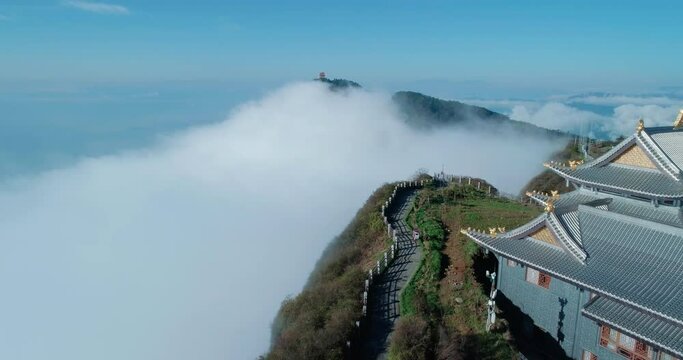 The scenery of the Golden Summit of Mount Emei cliff Surrounded by clouds at Sichuan China aerial landscape of Mount Emei