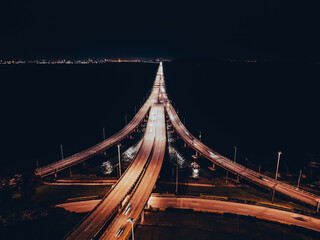 Night top view of the bridge illuminated by road lights