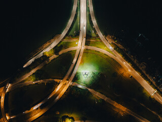 Night top view of the bridge illuminated by road lights