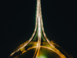 Night top view of the bridge illuminated by road lights