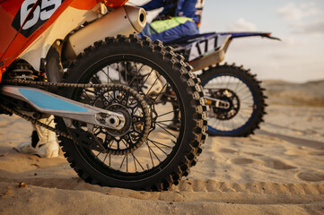 MX rider on motorcycle view from back wheel