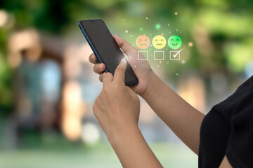 smart woman use smartphone choosing green happy smile face icon. feedback rating and positive customer review experience, satisfaction survey. mental health assessment. world mental health day concept