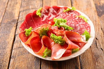 plate of salami and bacon