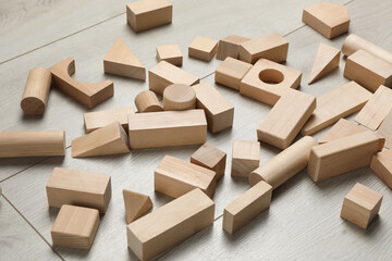 Wooden building blocks set on floor. Child's toy