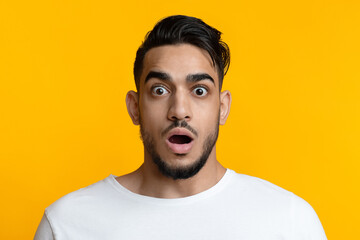 Closeup portrait of shocked arab guy looking at camera