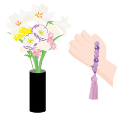 仏教のお供えの春の花と拝む手